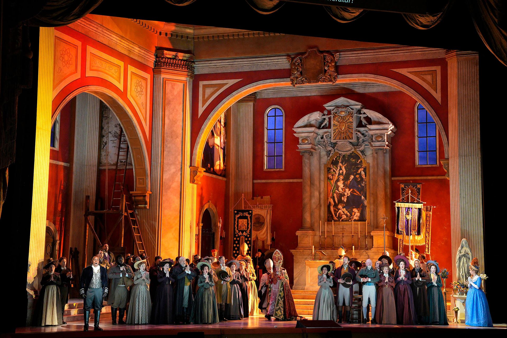 Opera set of a church with cast members on stage