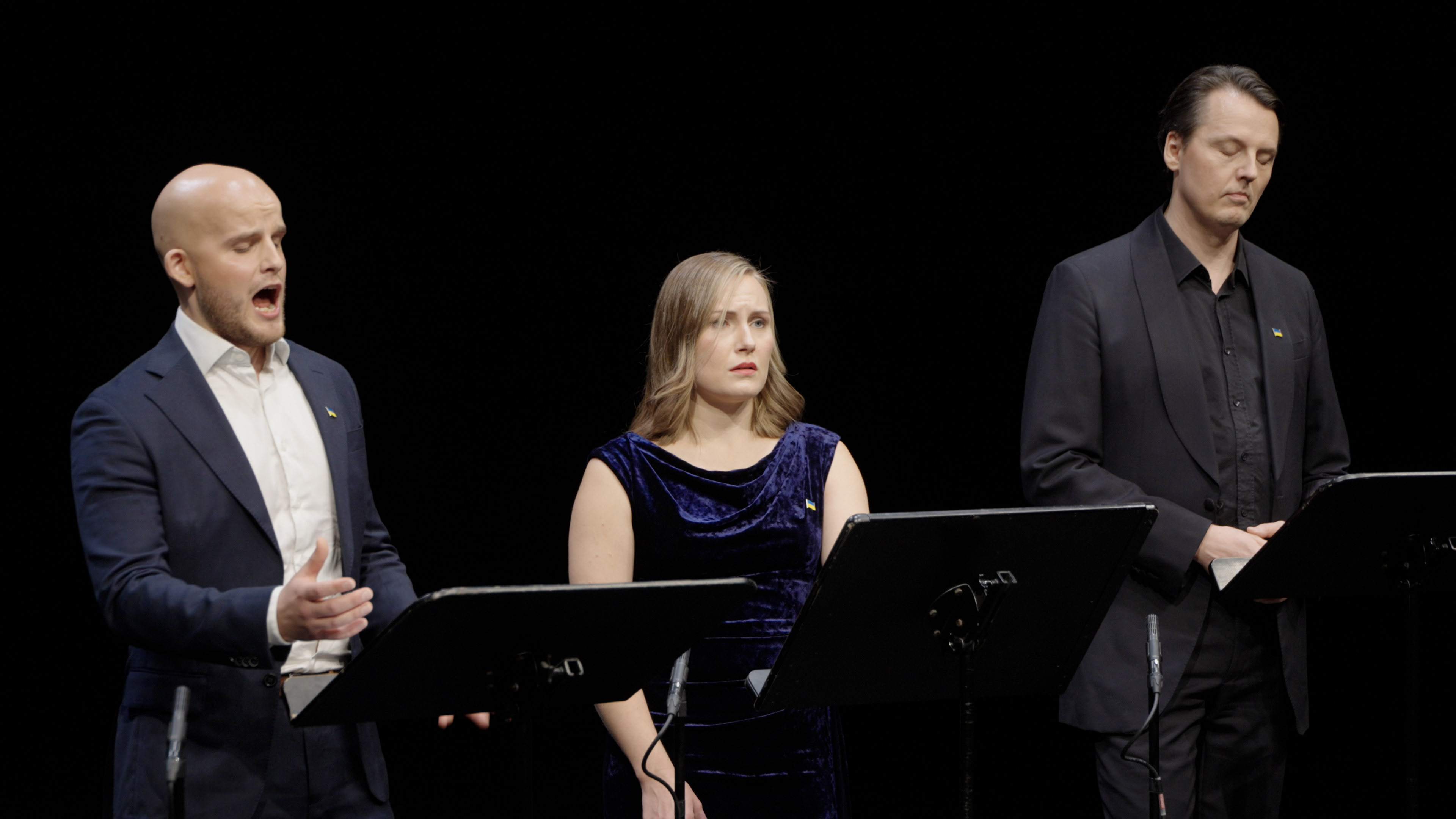 Singers standing at podiums