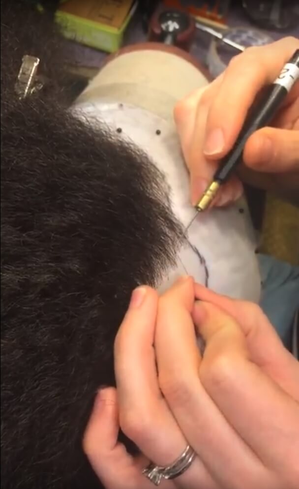 View video of Ashley Joyce finishing a wig.