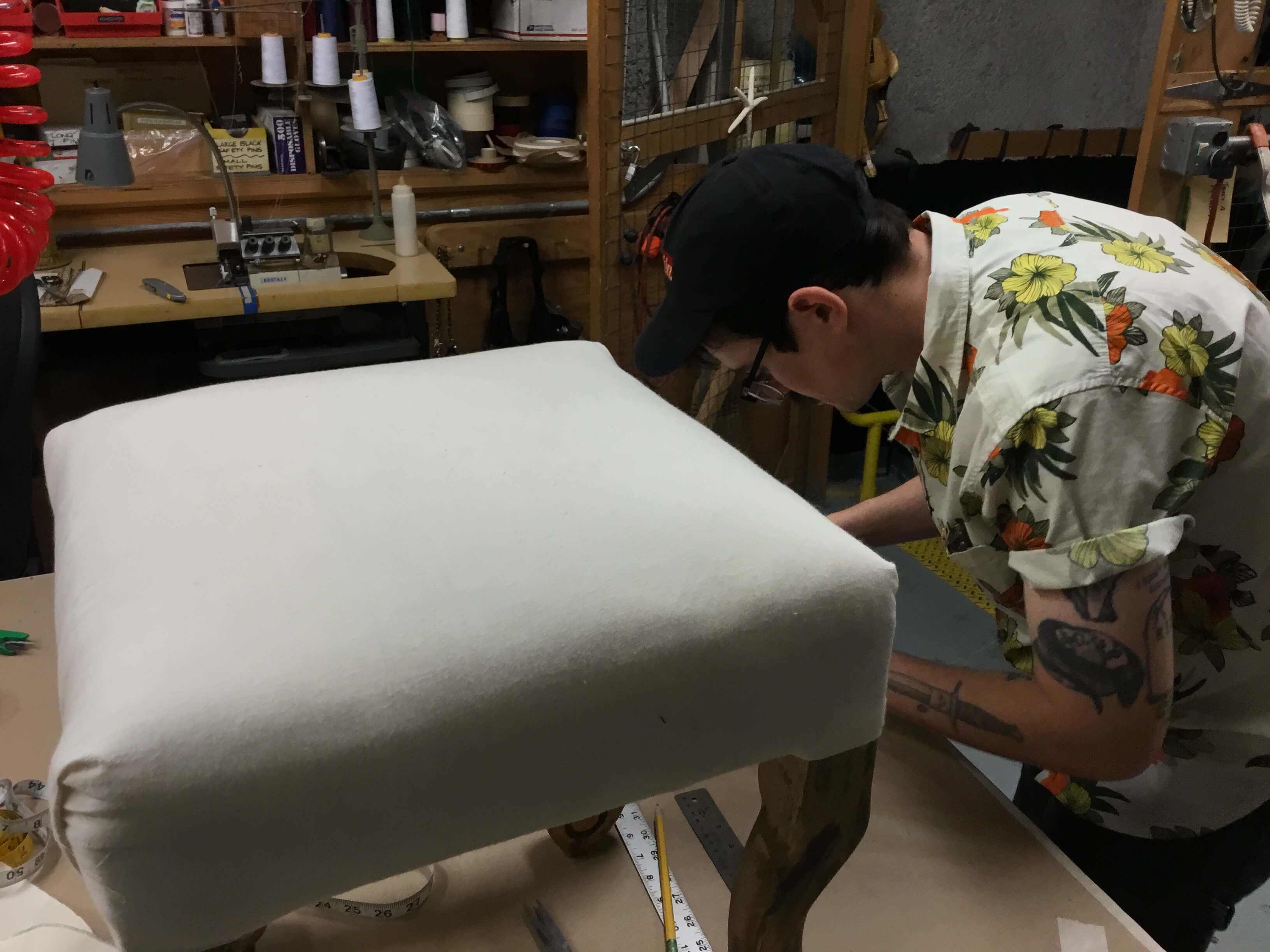 Prop artist John Matlock working on the shrinking down of the Tosca stool for Act II.