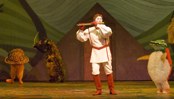 The Magic Flute Opera with person playing flute to animals on stage