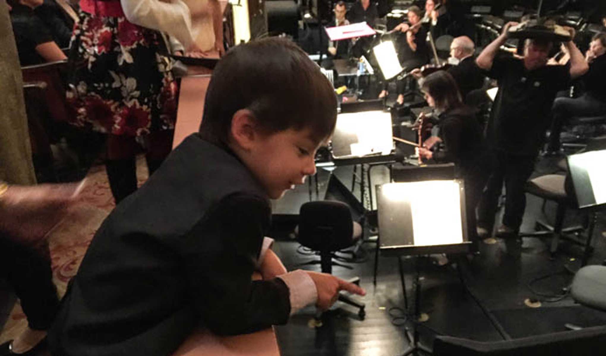 Nathaniel visits the orchestra pit for the first time. Photo courtesy Bob Epstein.