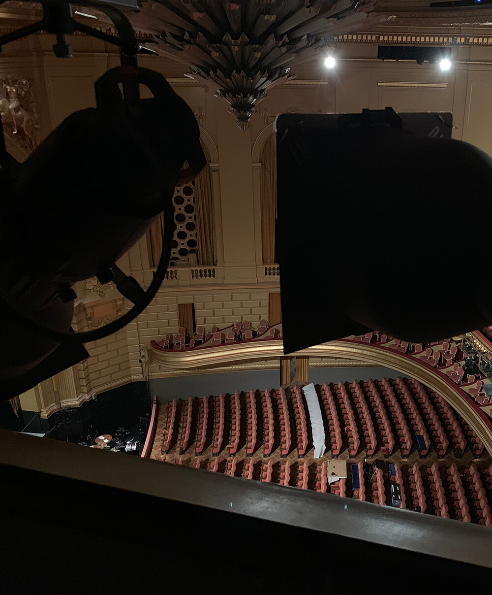 Two images of speaker locations, one in the organ bays and one in the lighting position at the top of the auditorium.