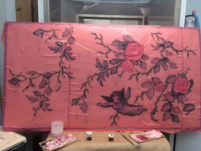 More steps of the process as Amy applies hand-painted detail to the fabric using acrylic paints.