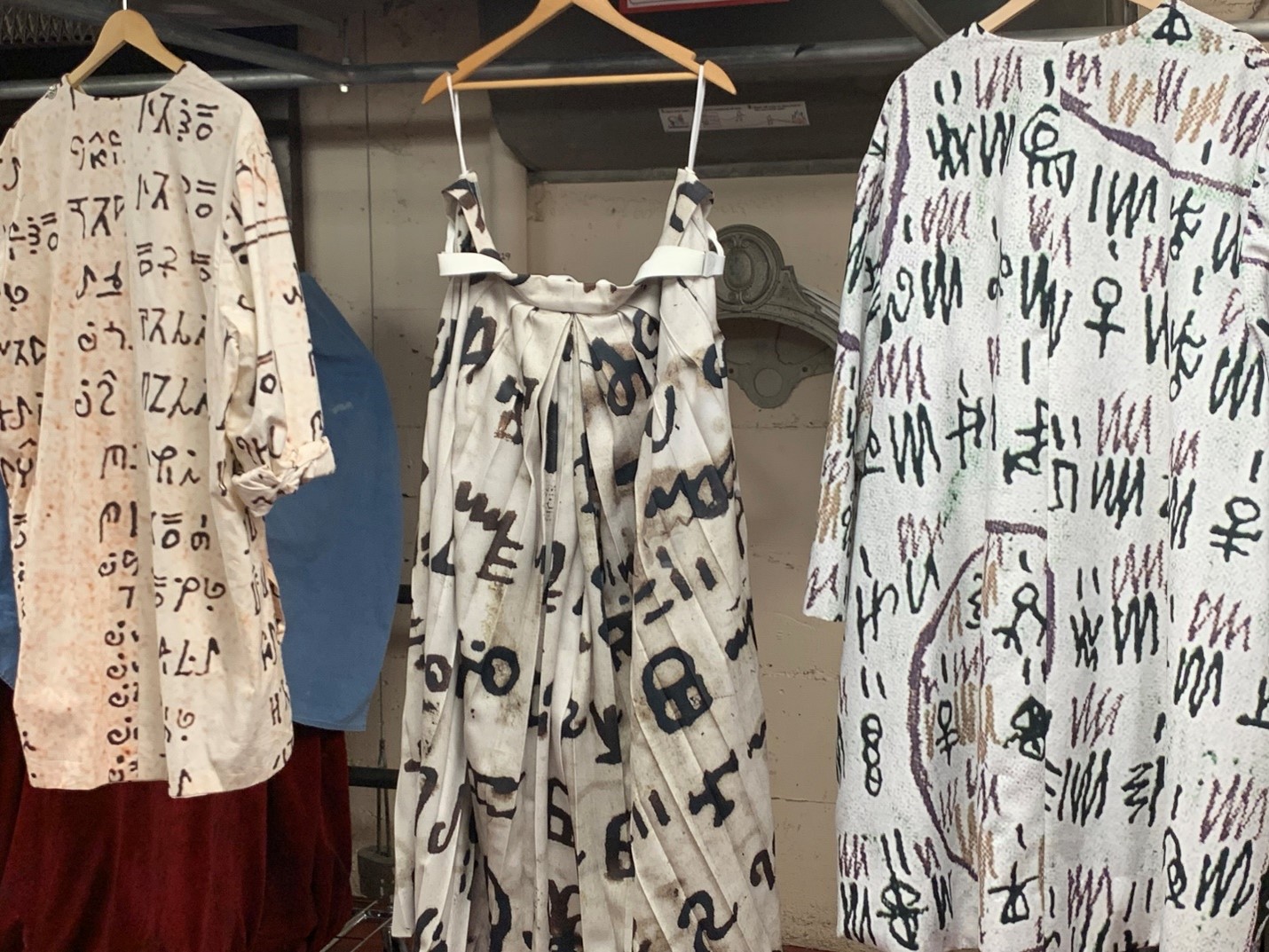 Costume pieces from the Middle Passage scene incorporating a variety of West African languages