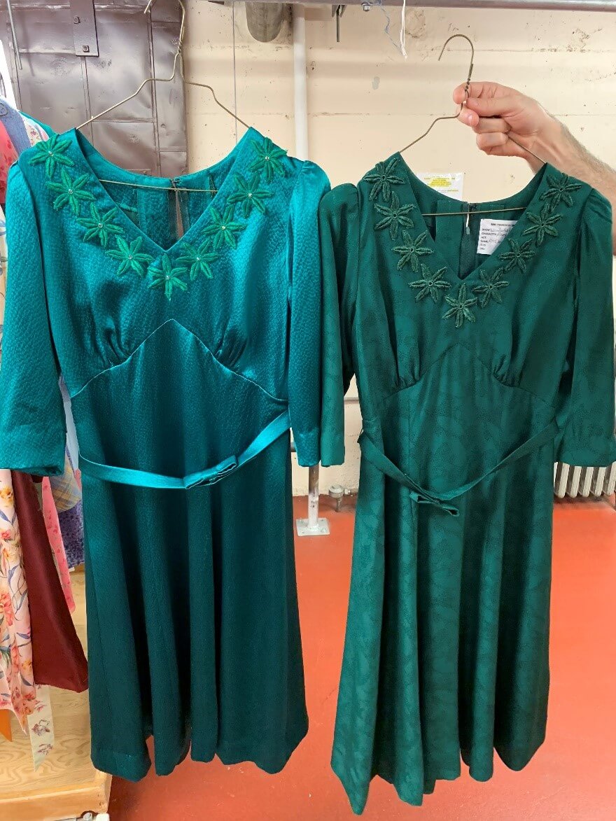 Mary&rsquo;s two Christmas dresses, the first on the right in darker green and the more joyful one in electric green on the left.