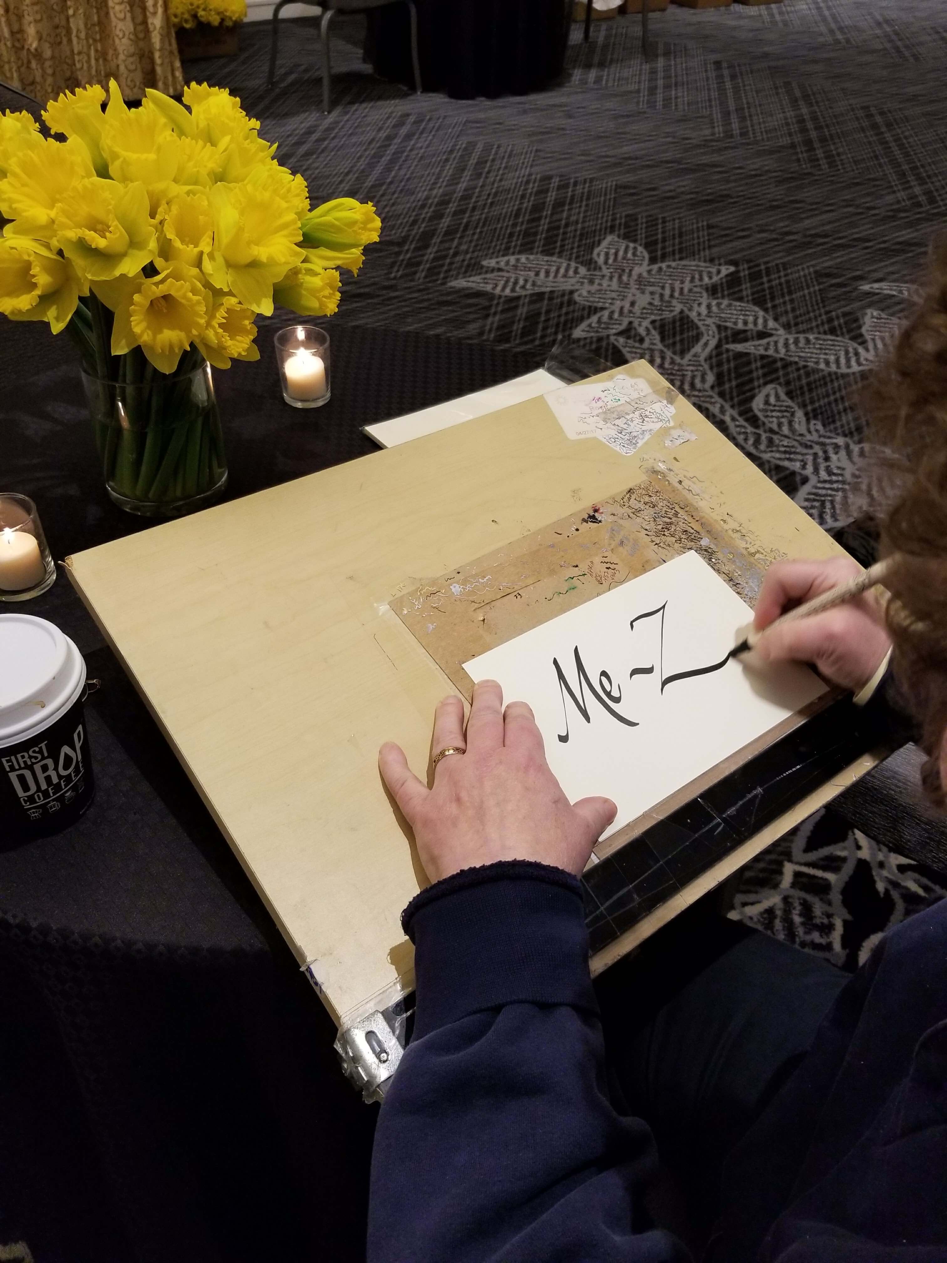 Calligrapher Rona Siegel working on last minute preparations at the Ritz hotel.