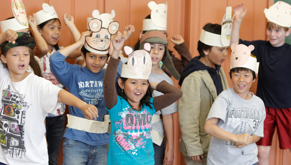 ARIA kids wearing paper hats