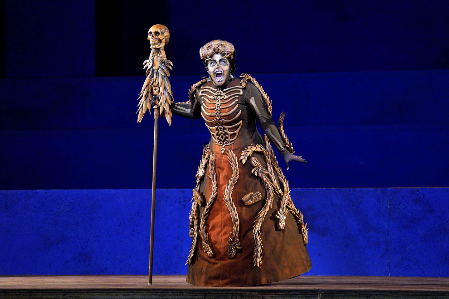 Scene from Frida of a woman dressed in a skeleton costume on stage.