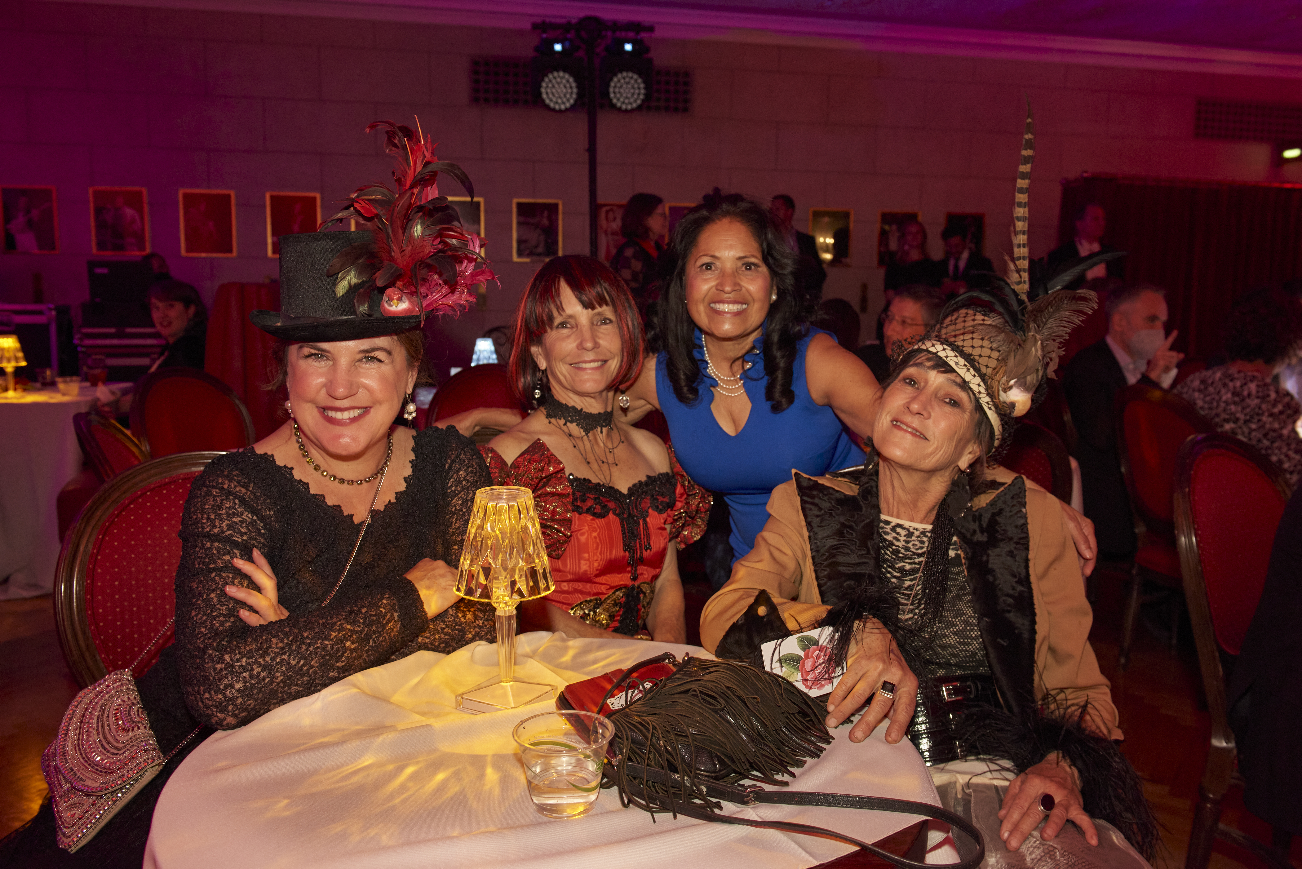 guests dressed up in costumes sitting at a table