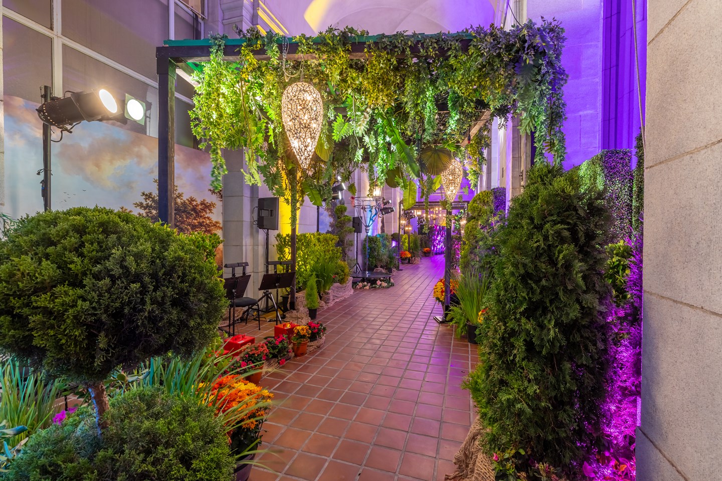 beautiful hallway decked out with plants, shrubs and flowers