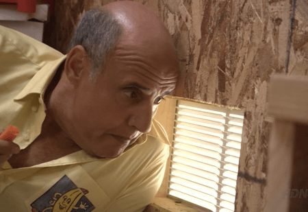 George listening to conversation through air vent