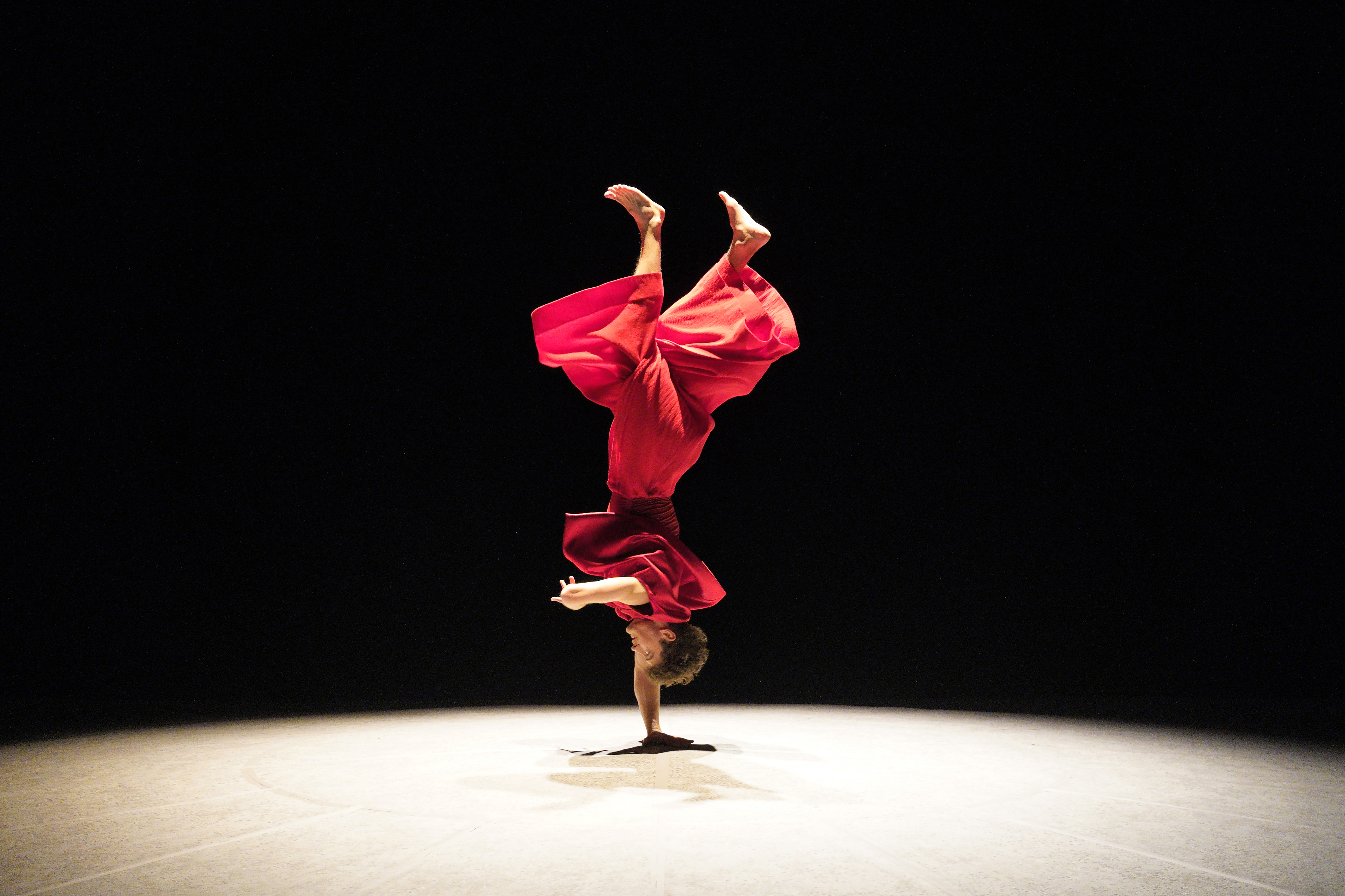 Jakub Jozef Orlinski standing upside down on one hand