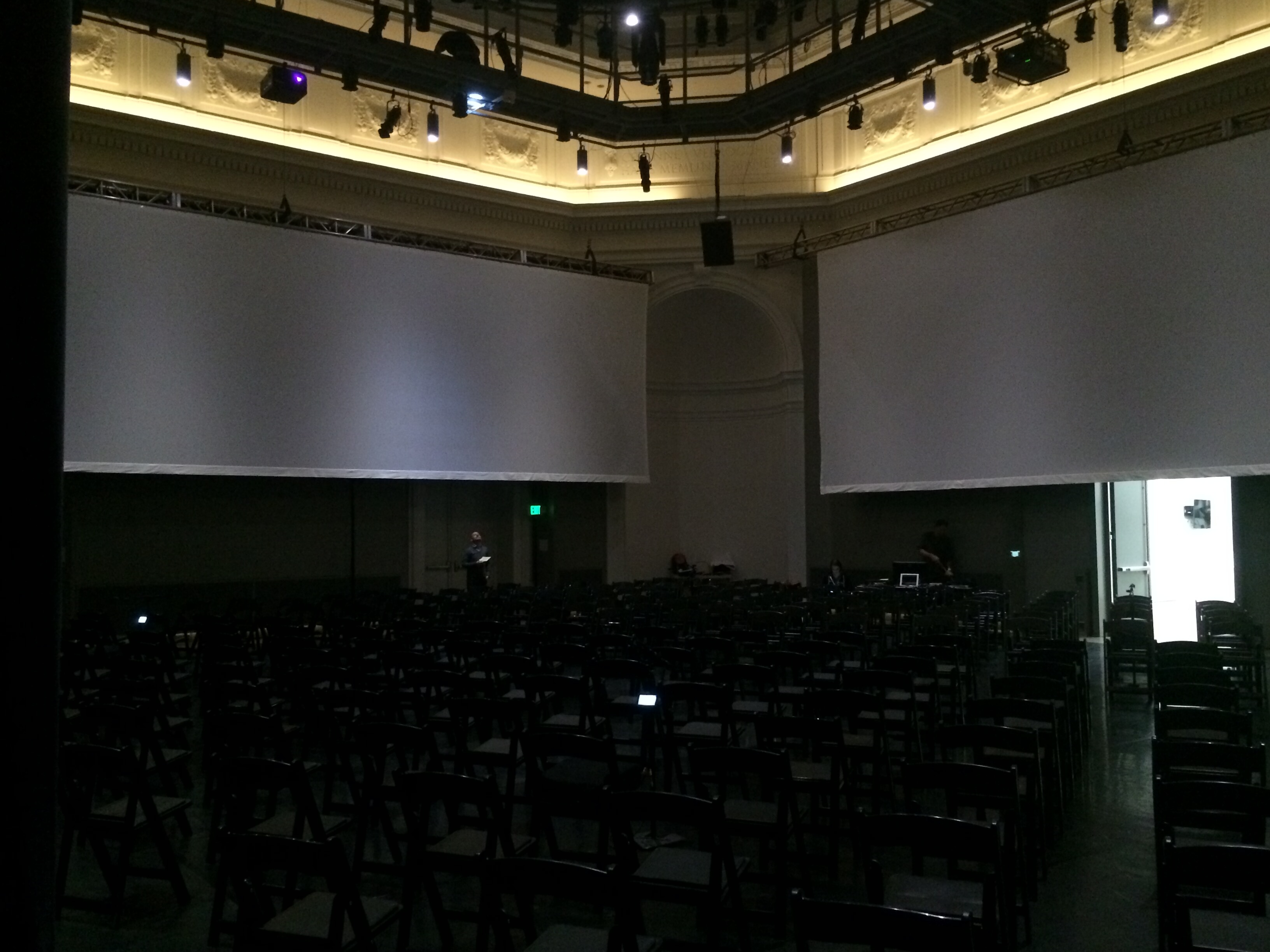 The projection screen set up for The Source in the Wilsey Center Taube Atrium.