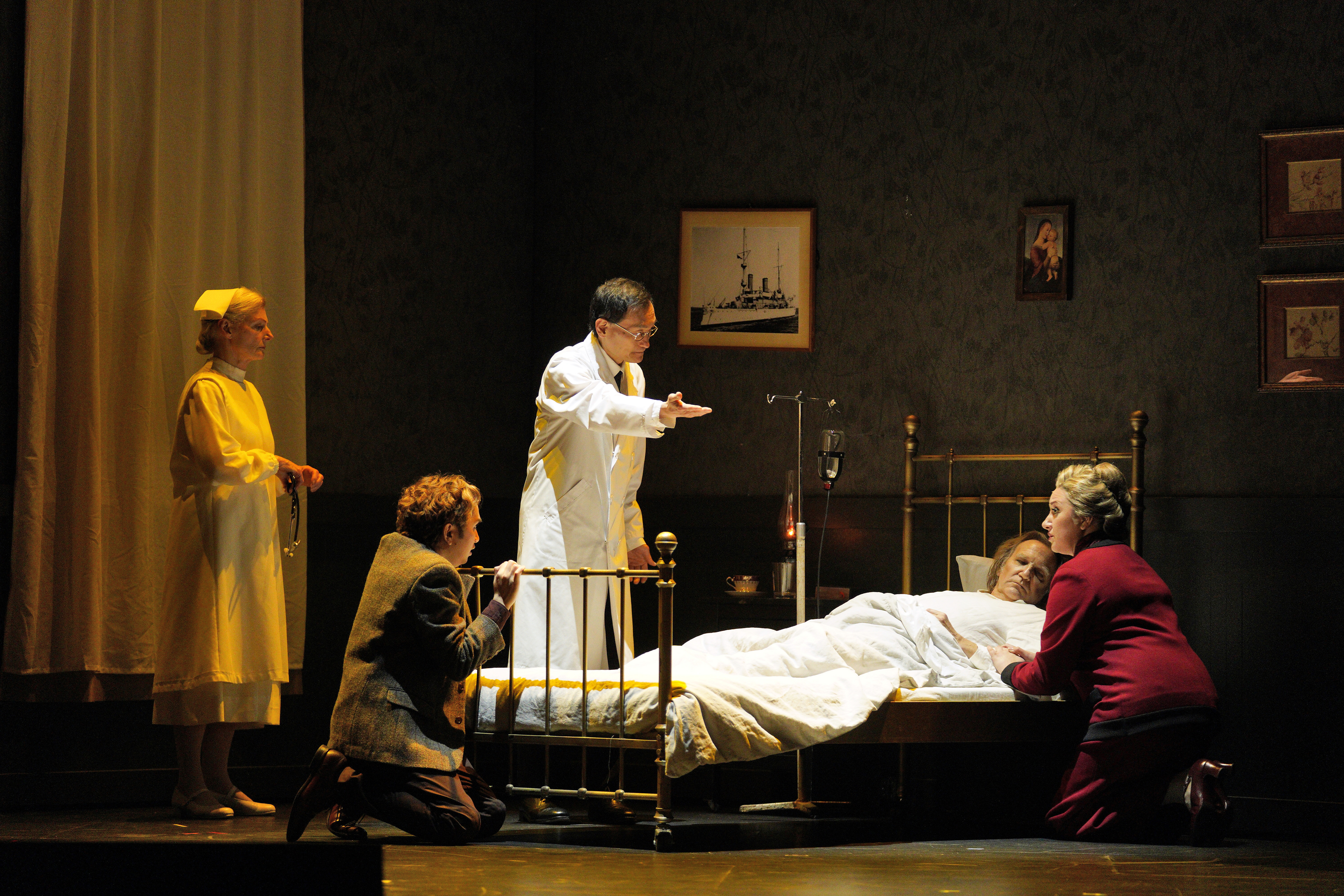 Doctor over patient in bed