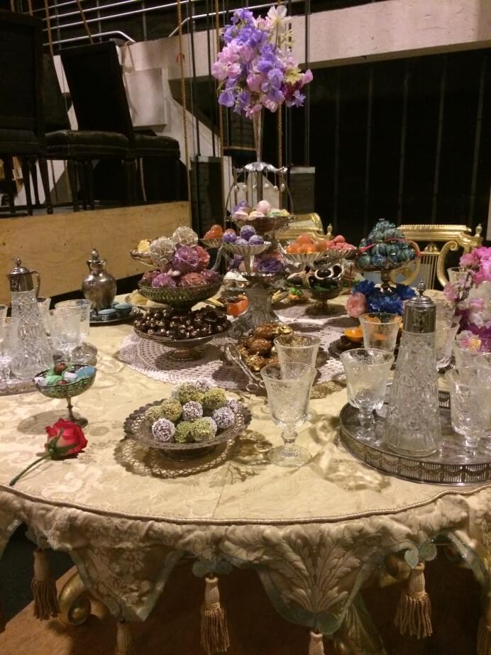 Ornate period table setting for Andrea Chenier. Photo by Matthew Shilvock.