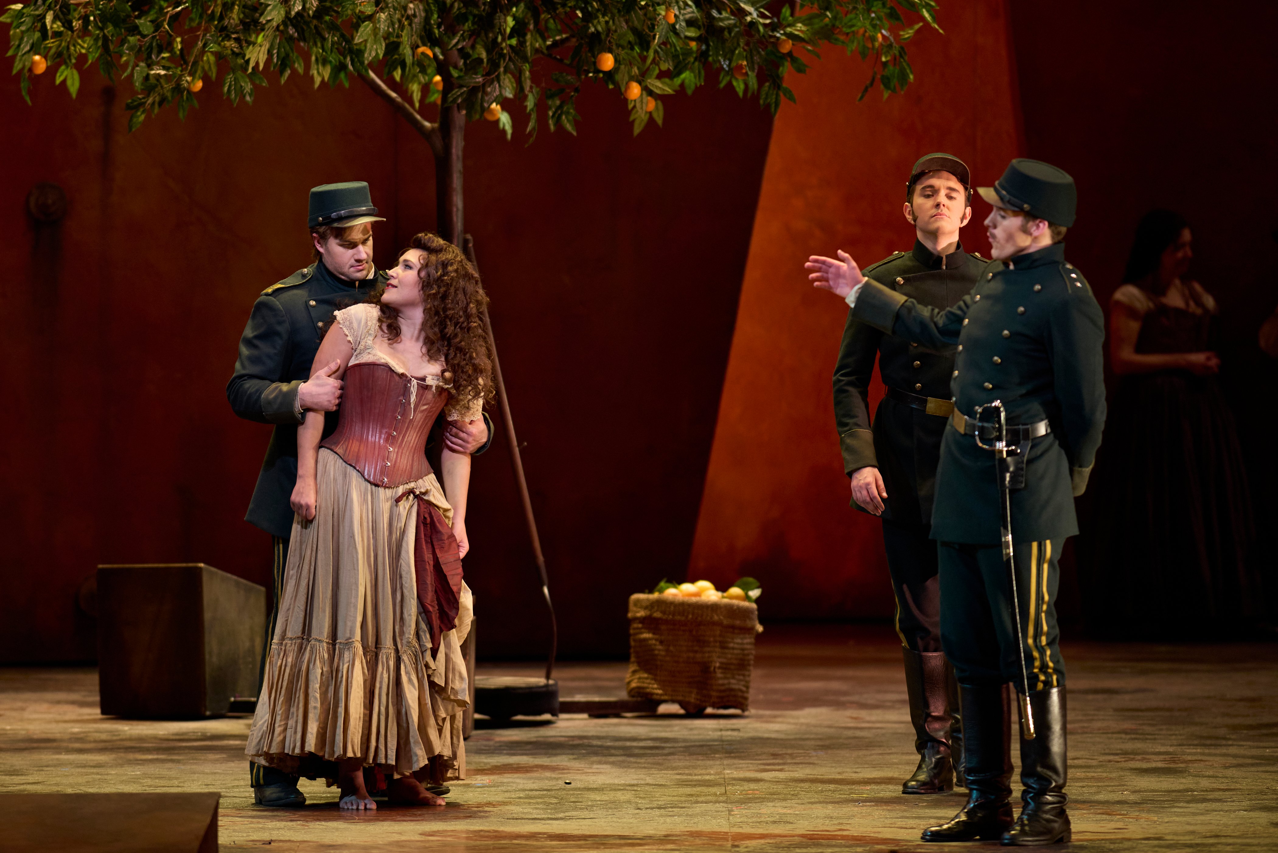 Nikola Printz as Carmen, Thomas Kinch as Don José, James McCarthy as Zuniga, and Samuel Kidd as Morales in Carmen.