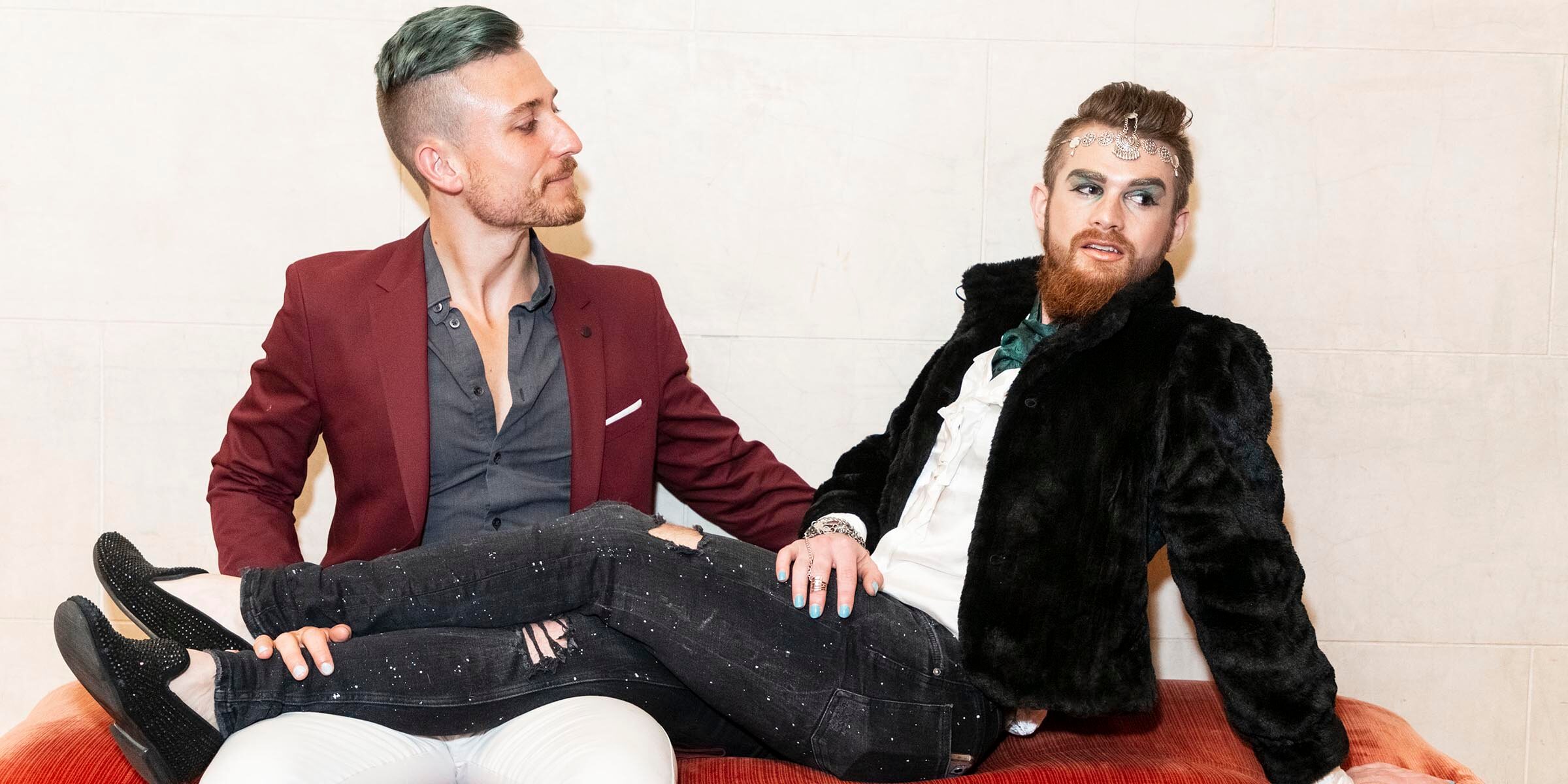 Two people sitting on a lounge chair talking_PC_Drew Altizer Photography.