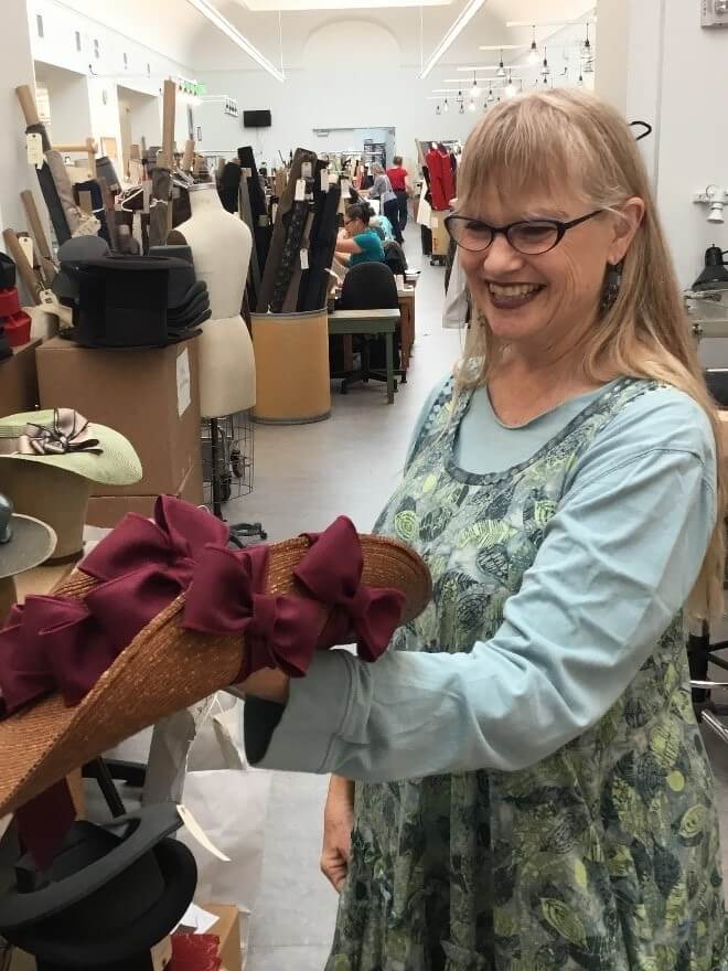 Paula with a particularly elaborate bow pattern, this one tied to hold one of the sides up.