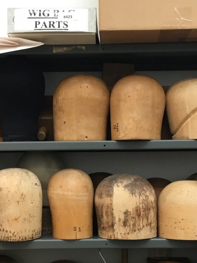 Wooden heads used for sizing and building certain hats.