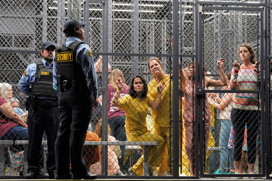 Prisoners in detention cages on the set of Fidelio (photo by Cory Weaver)
