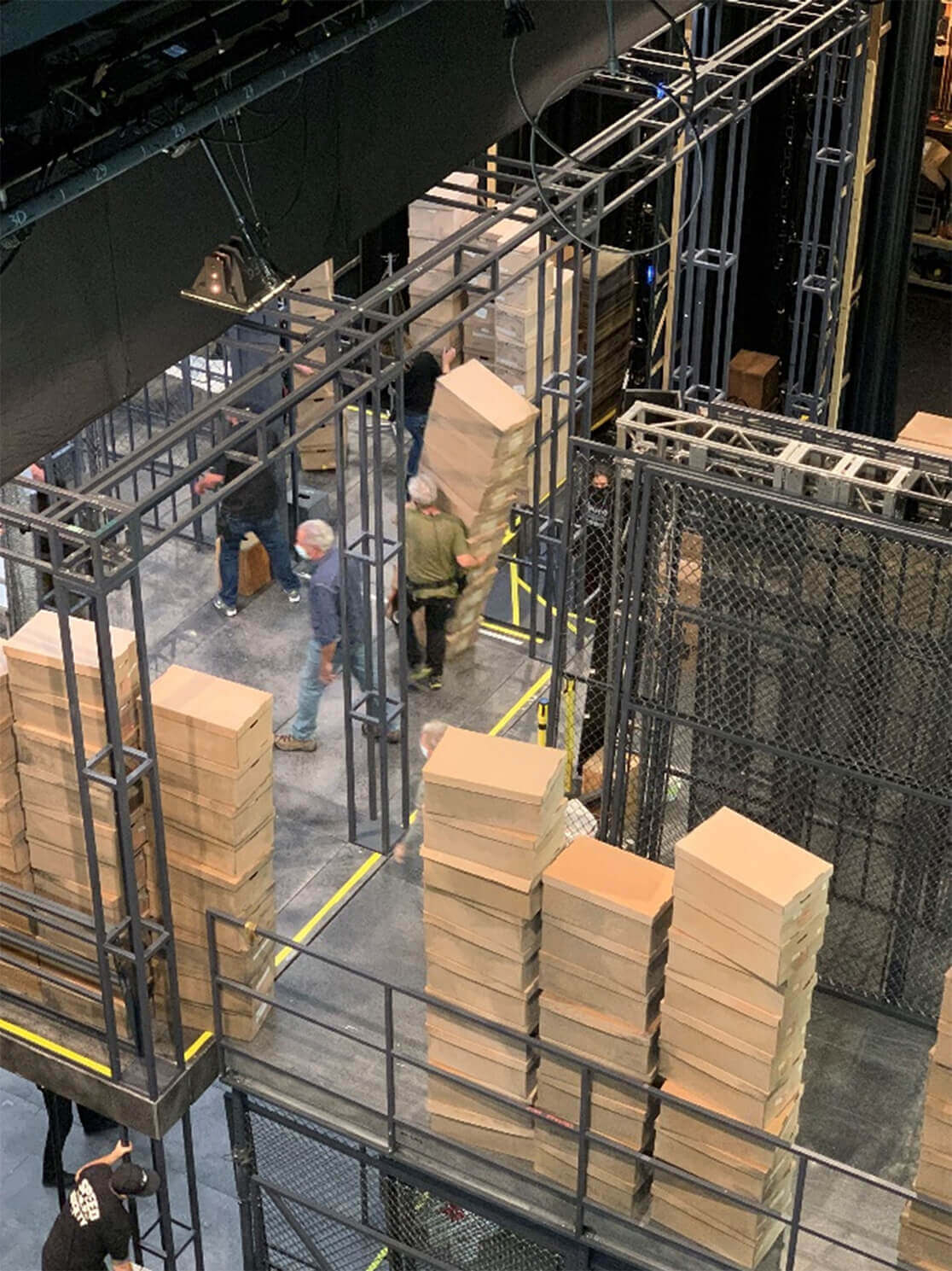 Moving the stacks of boxes into place for Act II.