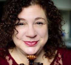 Close up picture of Kay with her chin on her violin