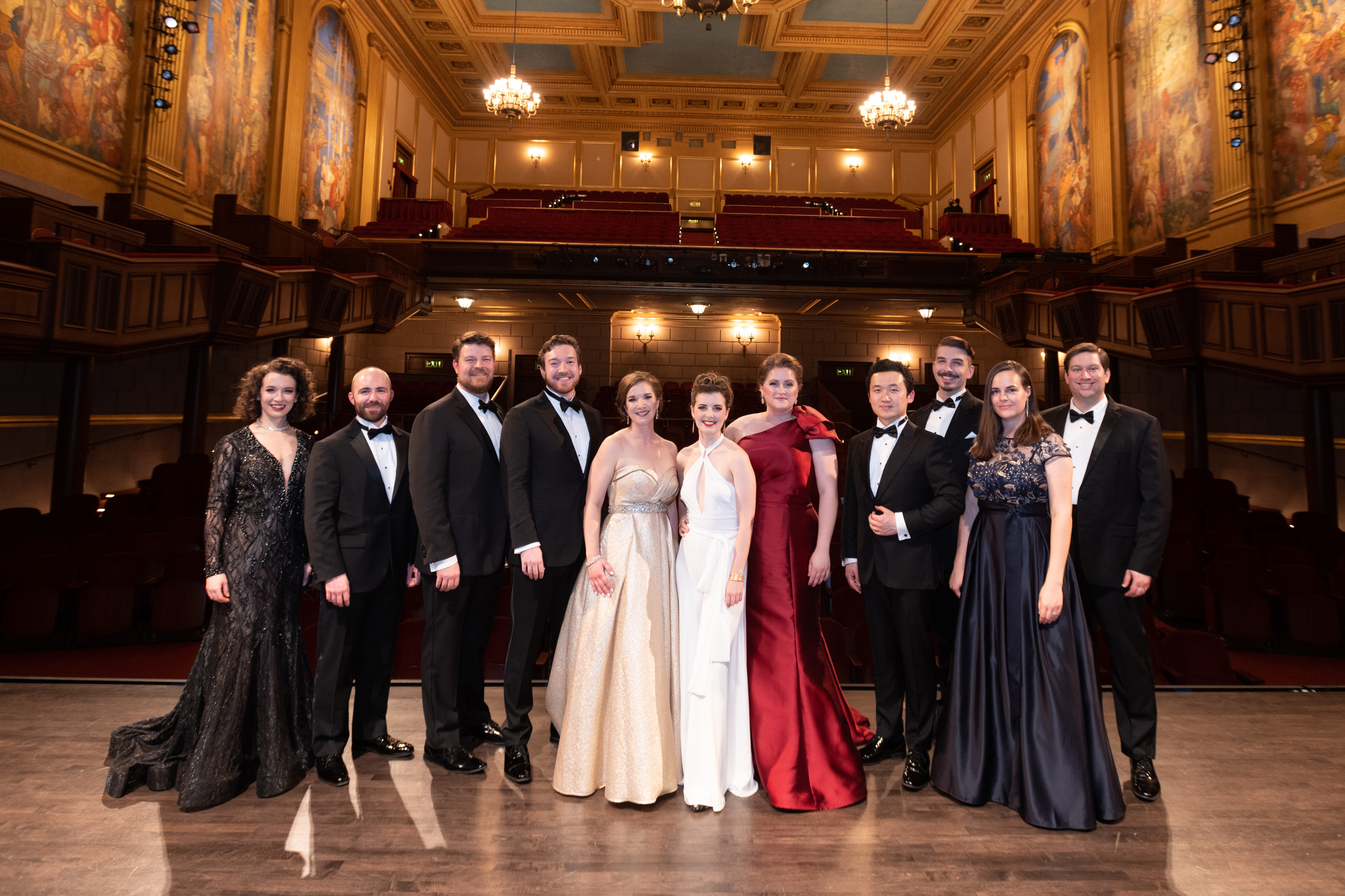 Merola Opera Program National Auditions with young professionals posing on stage