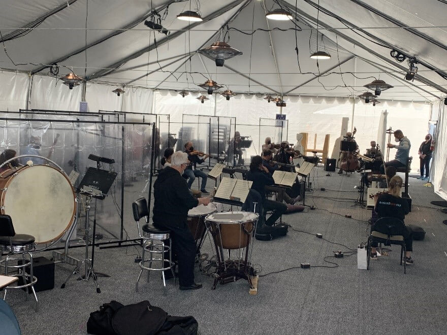 The Orchestra is set up in a dedicated tent just behind the stage
