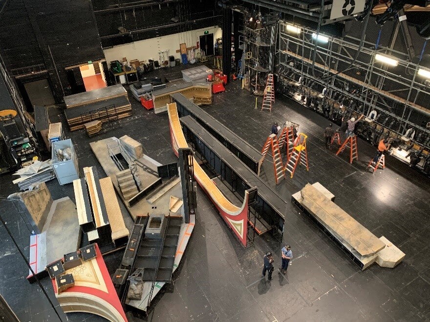 Scenes from load-in of Tosca: our incredible stage crew, hanging the lighting instruments (we have eight lighting bridges), and loading in the scenery.