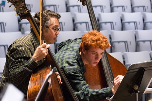 San Francisco Opera Orchestra's Steven D'Amico (Bass) works with Atticus Simmons. Photo: Scott Wall