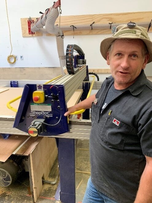 Dylan Maxson with the CNC router, cutting out some recurring pieces used to craft the Figaro set.