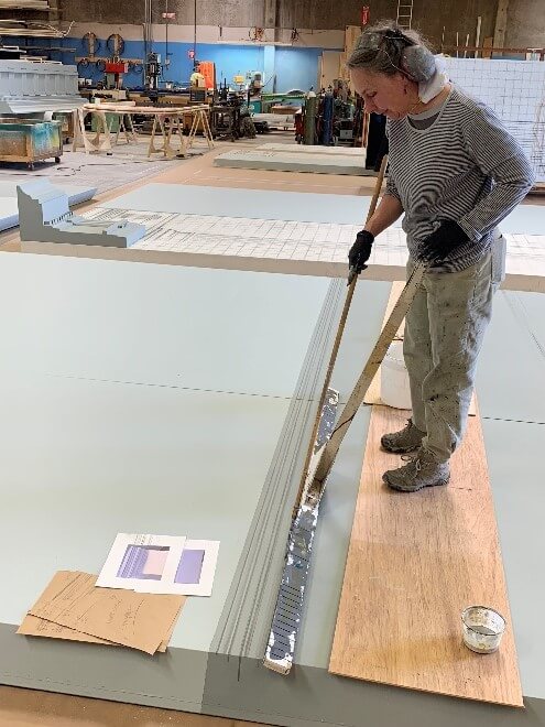 Scenic artist Lauren Abrams creating trompe l’oeil effects.