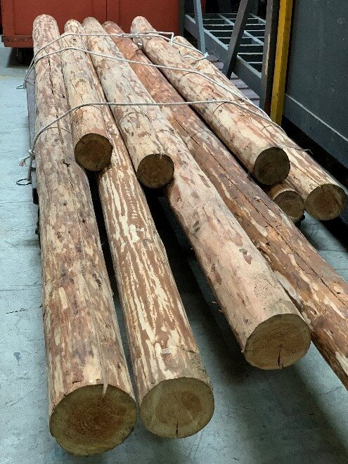 The stripped lumber used in the Figaro scaffold, both in its untreated state and then its finished state. You can then see the constructed scaffolding backstage during technical rehearsals.