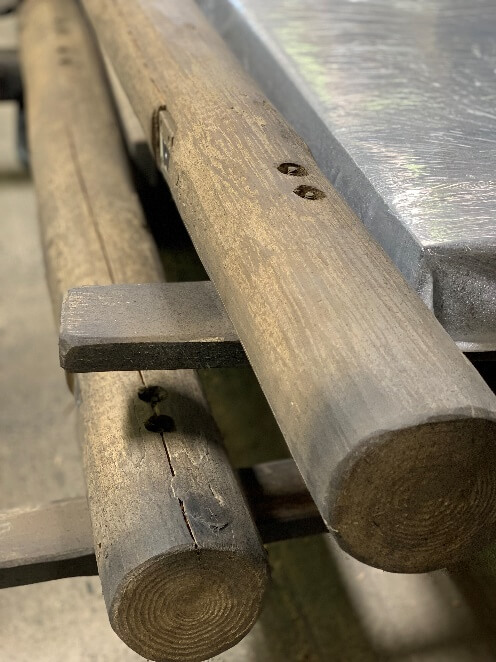 The stripped lumber used in the Figaro scaffold, both in its untreated state and then its finished state. You can then see the constructed scaffolding backstage during technical rehearsals.