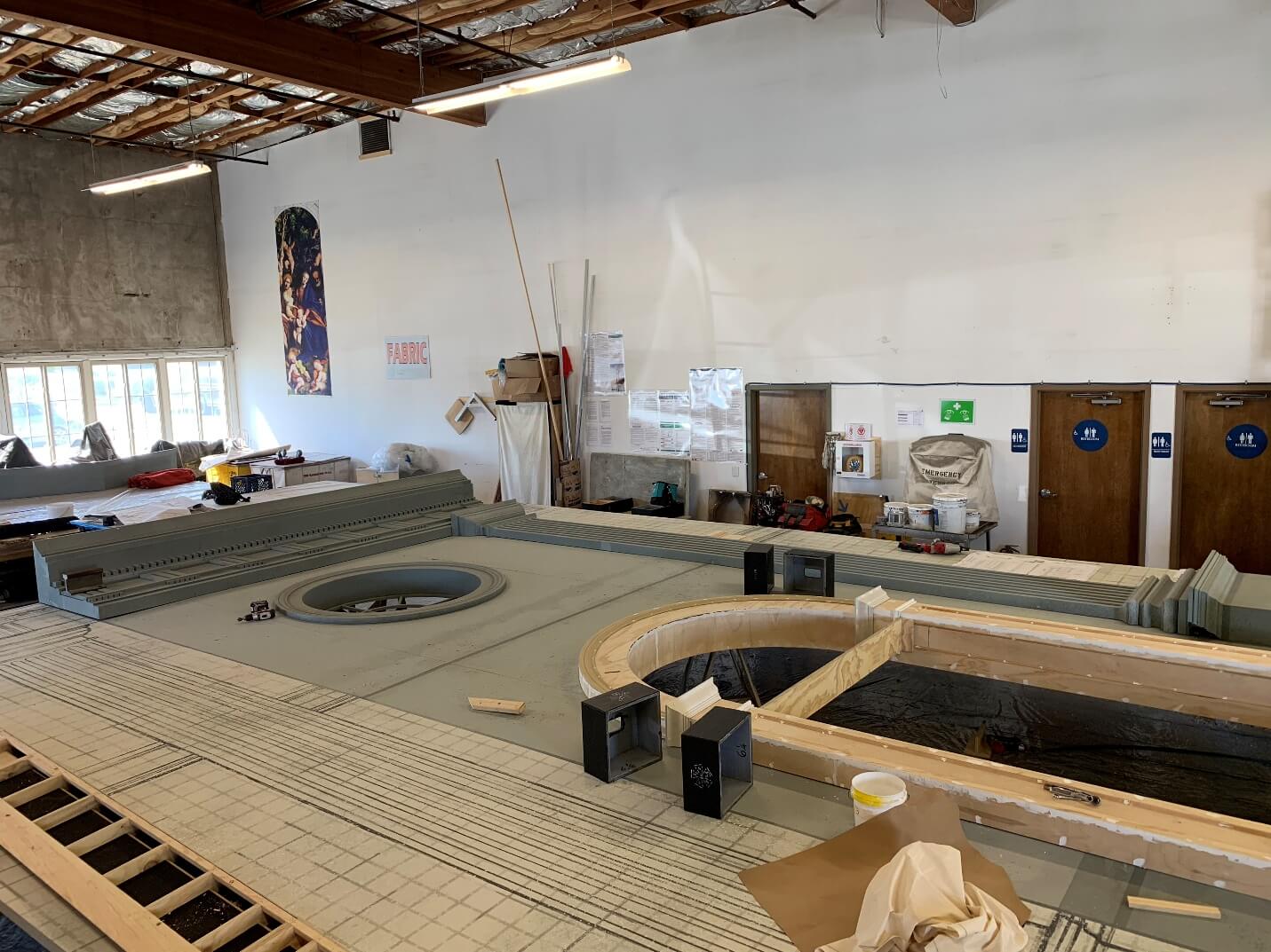 Putting all the pieces together: the three-dimensional pieces and architectural drawings are attached before being transported up to the Opera House.