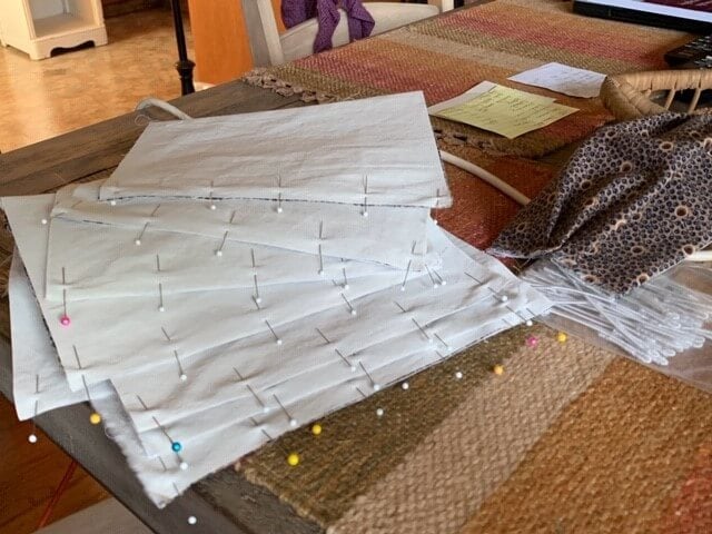 Senior Milliner Paula Wheeler shares a photo of pin-marked pleats ready to be stitched.