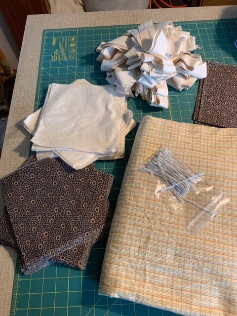 Senior Milliner Paula Wheeler&rsquo;s fabrics after partial cutting, ready to make masks!