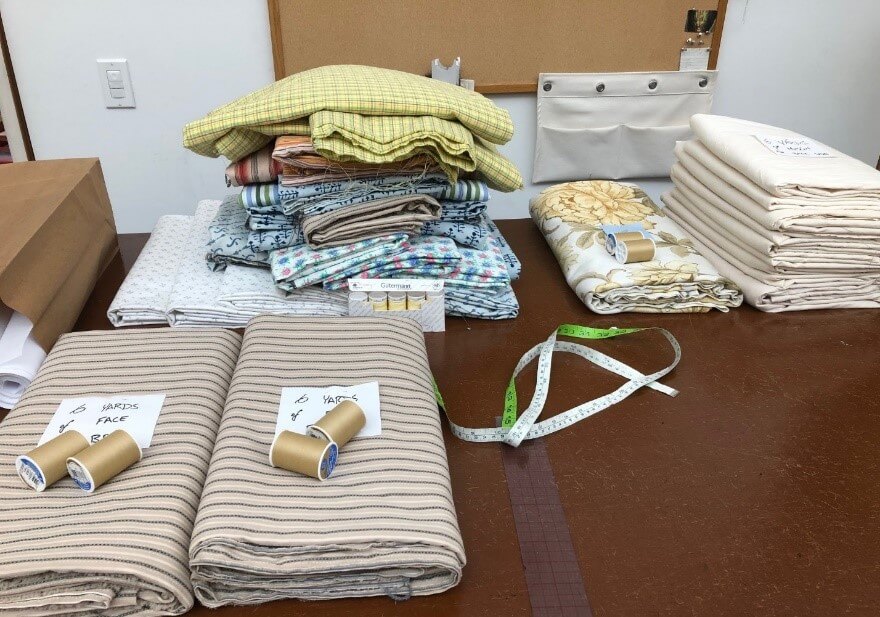 Fabrics cut, washed, and prepared for the stitchers.