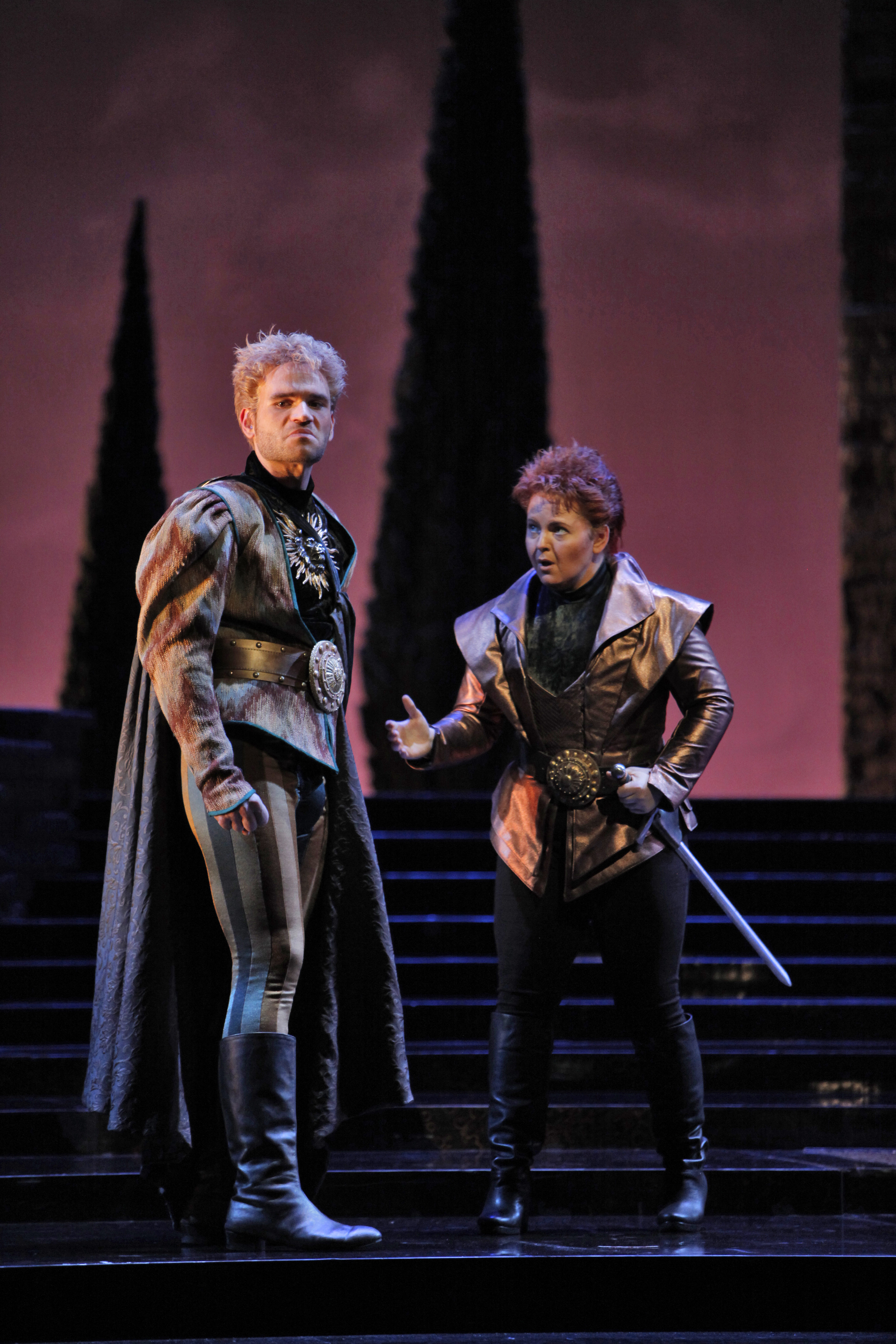 two people, one angry on stage