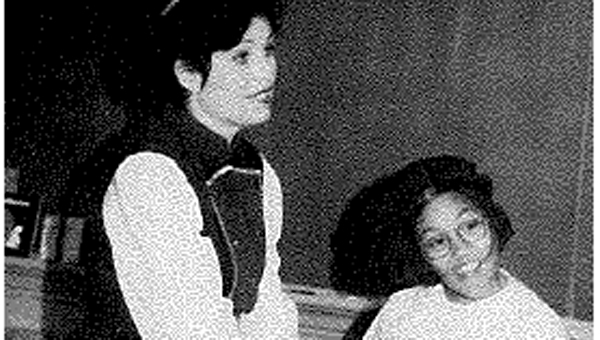 Opera à la Carte Coordinator Ellen Kerrigan with a student performing Daughter of the Regiment, 1993