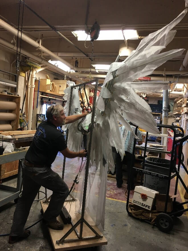 Dylan working with the wings in the Opera's upstairs prop shop.