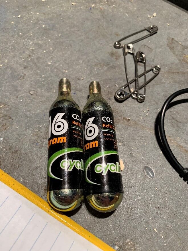 The mechanics of the wings: the full set up; the adjusters for air speed; the switch for the singers, and the small CO2 tanks (compare to the size of the safety pins!).