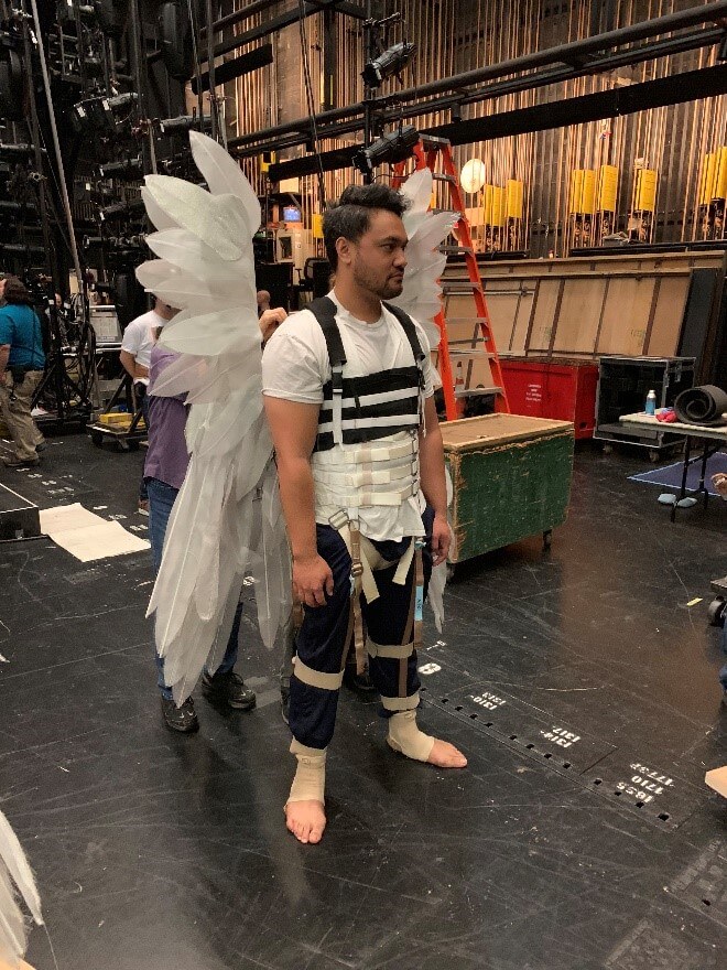 The Adler angels being prepped for their flying technical rehearsal, supported by members of the grips crew Paul Delatorre and Geoff Heron, and Jim Holden from our props crew.