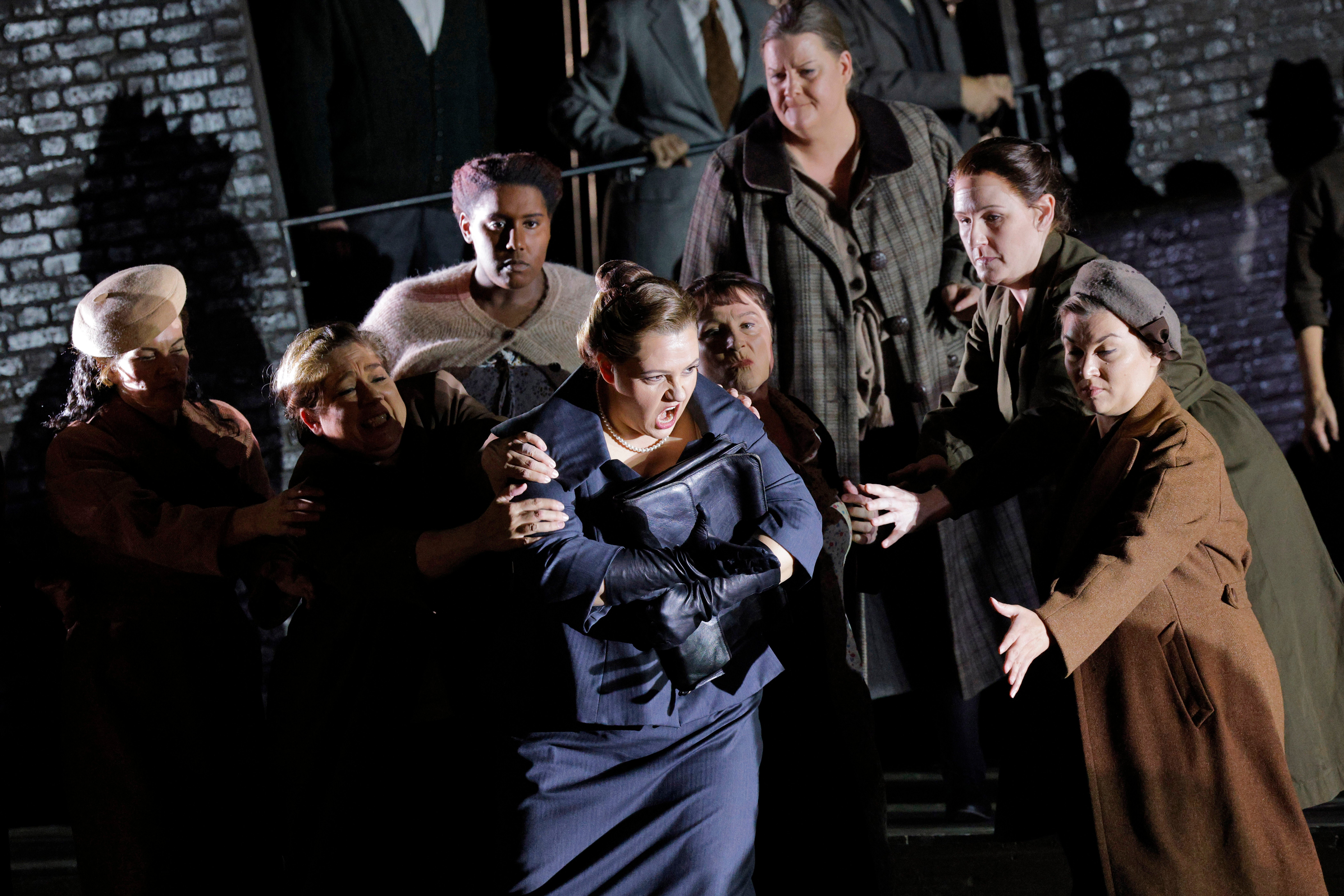 women being restrained by other people