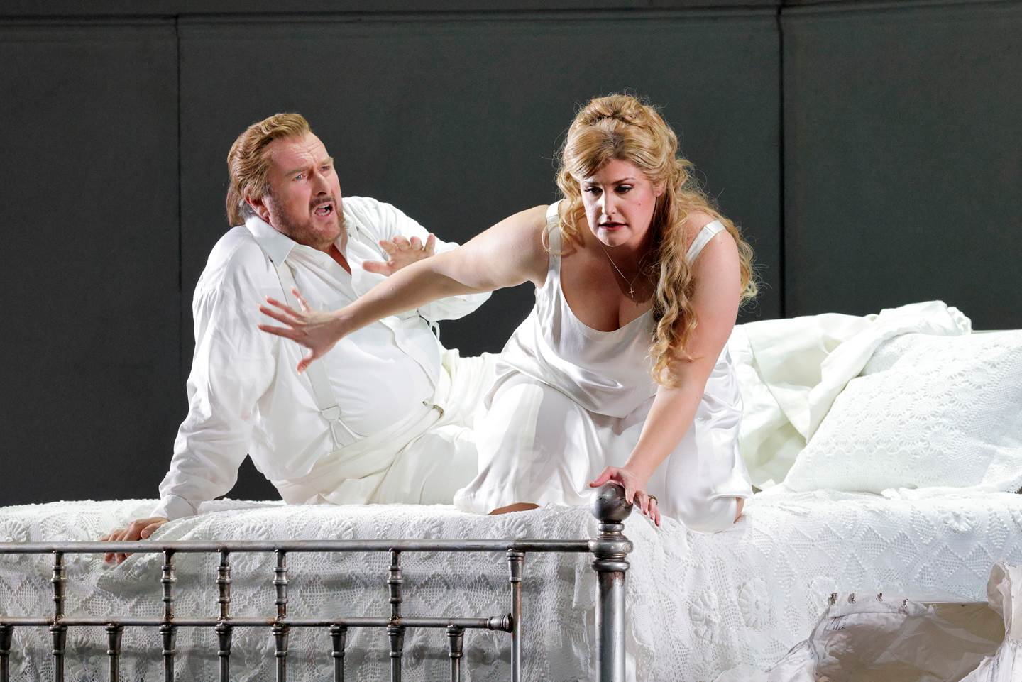 couple on bed apparently arguing