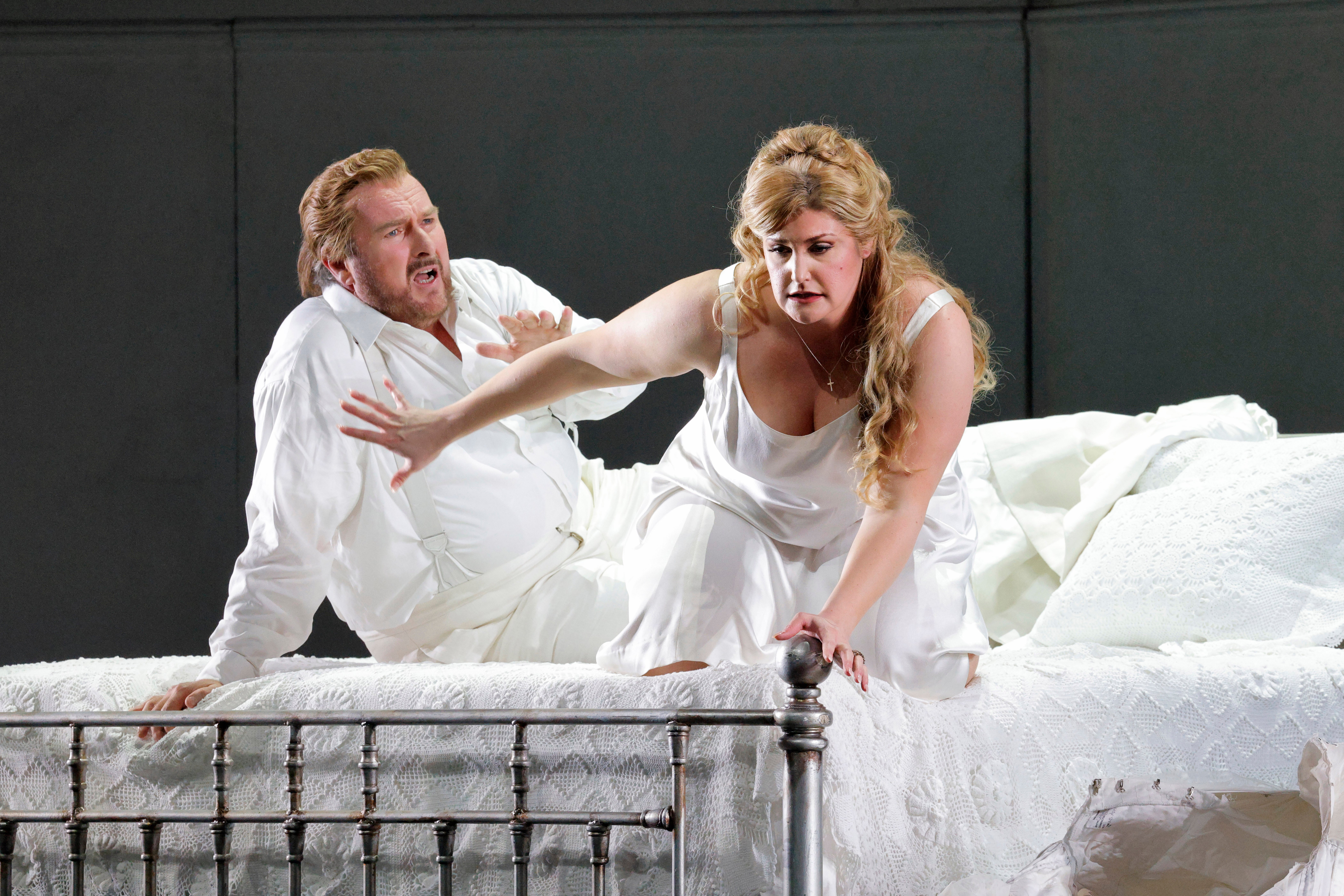 couple on bed apparently arguing