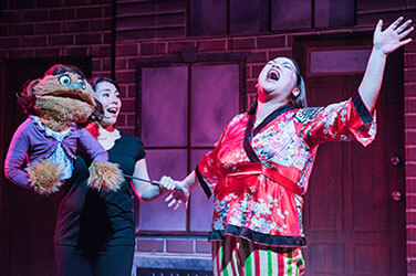 Pam as Christmas Eve in Avenue Q. Photo by Lois Tema.