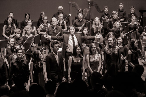 Conductor Ming Luke leads a final bow. Photo: Avi Glibicky.