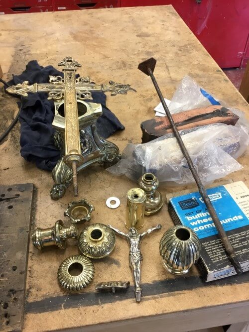 Religious metalware, being prepared and cleaned in the prop shop.